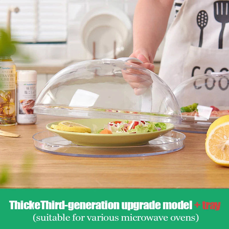 A clear microwave splatter guard with a handle is shown resting on a wooden table next to fresh food.