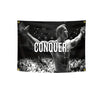A black banner featuring a muscular man with his arms raised, overlaid with the text CONQUER.