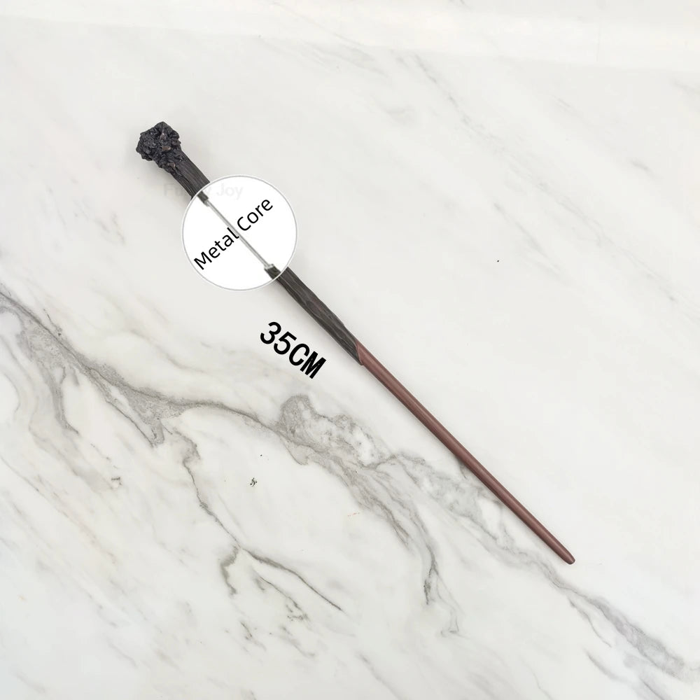 A black metal magic wand replica with a metallic core is displayed on a white marble surface.