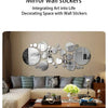 A display of various round mirror wall stickers decorating a modern living room wall.