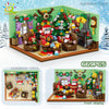 A set of 669 building blocks depicting a Christmas scene with Santa, a decorated tree, and train models.