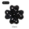 A set of ten black heart-shaped foil balloons, 18 inches each, for party décor.