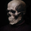 A realistic latex skull cosplay mask displayed on a dark background.