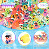 A pile of glow-in-the-dark resin cruise duck decorations in various bright colors and sizes.