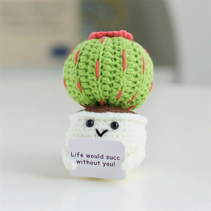 Handmade crochet sunflower desk companion with a smiling face, featuring green and red textures.