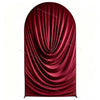 A deep red velvet drape or arch cover used for weddings and events.