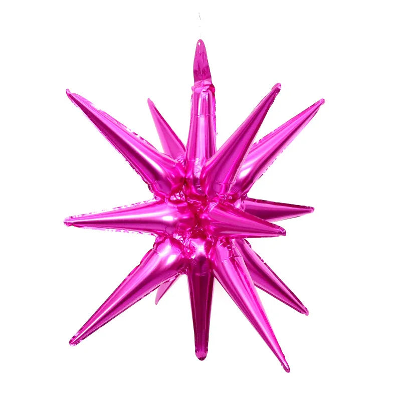 A vibrant pink star burst foil balloon with sharp points for party decoration.