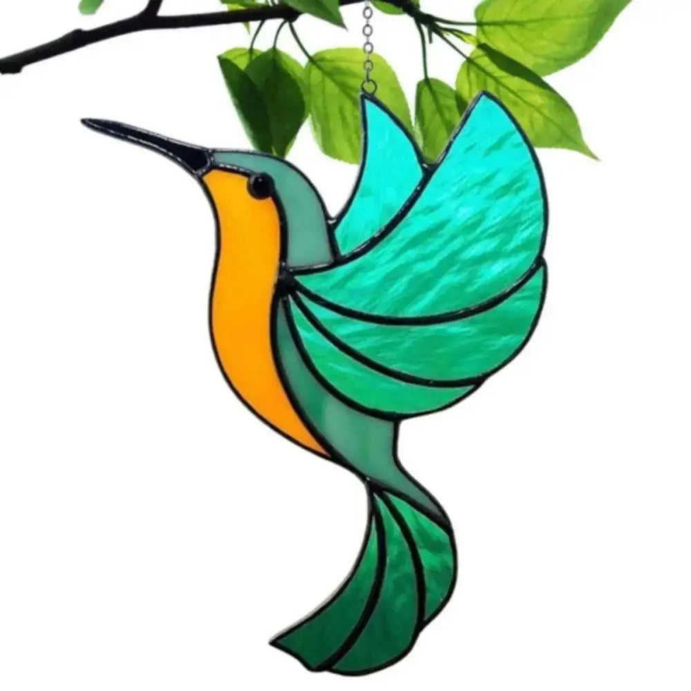 Colorful acrylic hummingbird suncatcher with iridescent green and orange wings hanging from a branch.