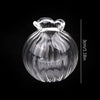 A clear glass vase shaped like a bottle with a flared rim, shown against a black background.