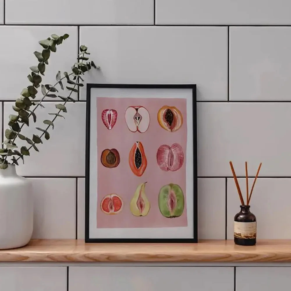 Framed canvas art featuring watercolor illustrations of various fruits like apples and citrus slices