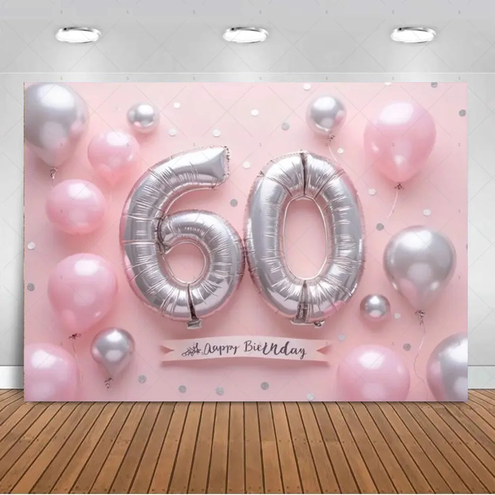 A pink balloon backdrop featuring silver and pink balloons with the number 60 and a birthday message