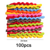 A stack of 100 assorted colorful latex balloons with wavy edges.