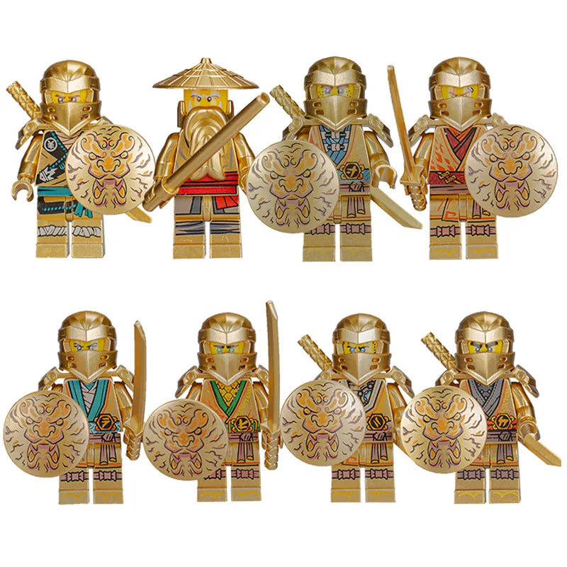 A set of five golden ninja building block figures with swords and circular emblems.