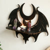 Black gothic bat moon floating wall decor featuring crystals and a lit candle
