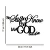 Black metal sign with script text Be Still and Know that I am God and Psalm 46:10