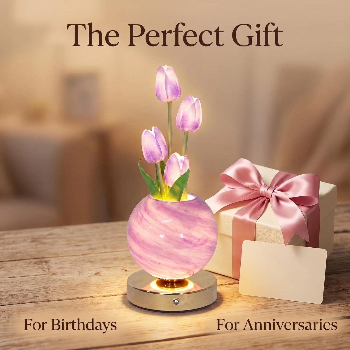 A pink tulip LED night light with a touch dimming feature displayed on a wooden surface.
