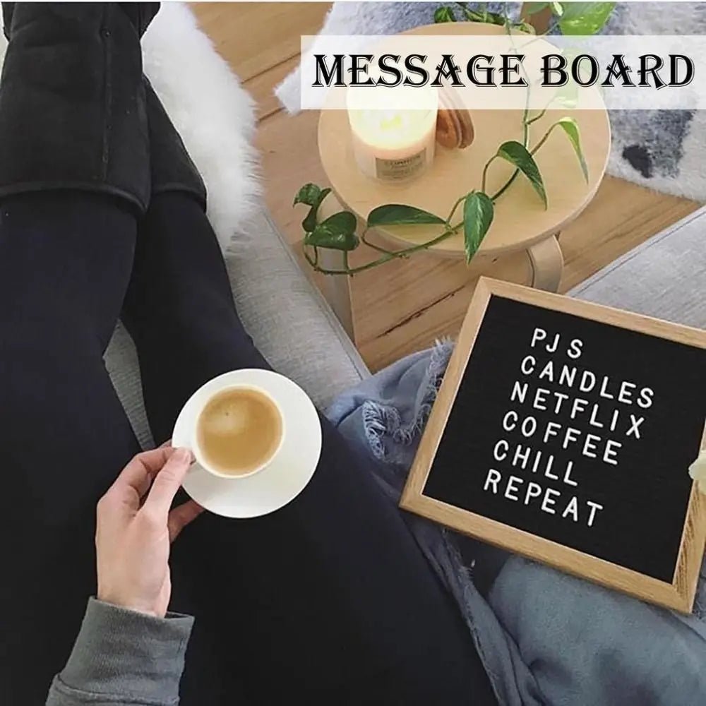 A hand holds a cup of coffee next to a wooden message board with text like PJS Candles Netflix Coffee Chill Repeat.