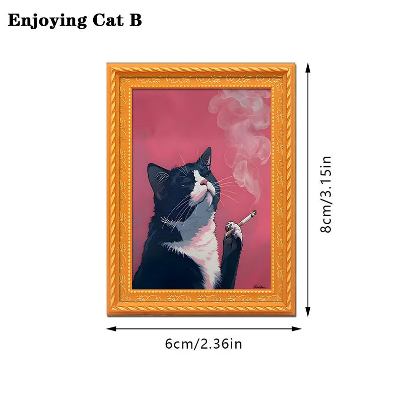 A framed picture of a black and white cat with pink smoke, displayed in an ornate gold frame.