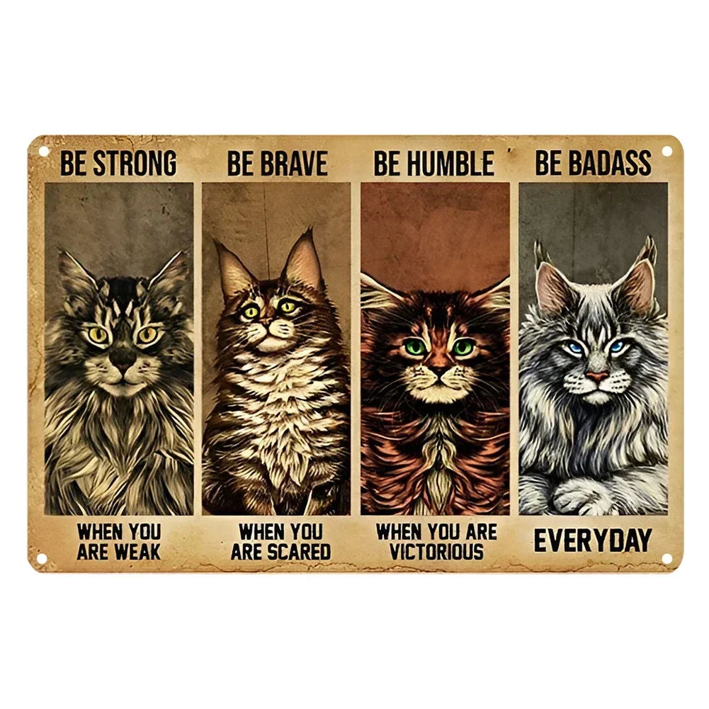 A vintage metal sign featuring four cats with inspirational quotes: Be Strong, Be Brave, Be Humble, and Be Badass.
