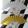 A golden glitter folding fan with transparent ribs shown in a fan shape.