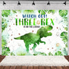 A vibrant watercolor illustration of a green dinosaur silhouette on a white background with tropical leaves and scattered nat