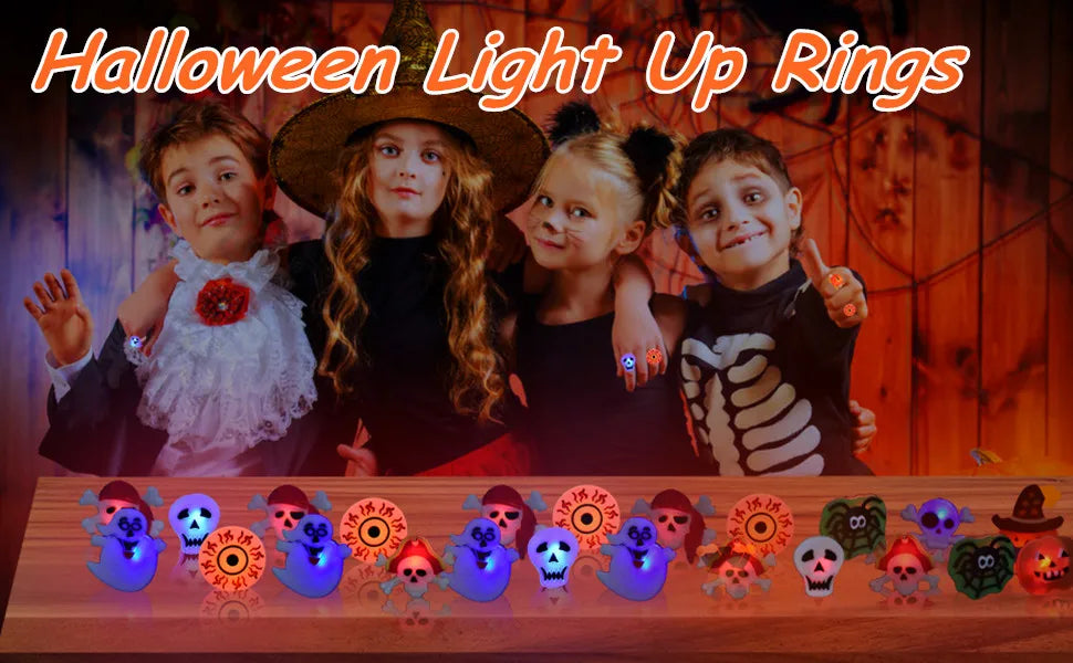 A display of Halloween light up rings featuring pumpkin, ghost, and spider designs.