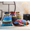 A set of ten vintage cotton drawstring gift pouches in various colorful patterns and textures.