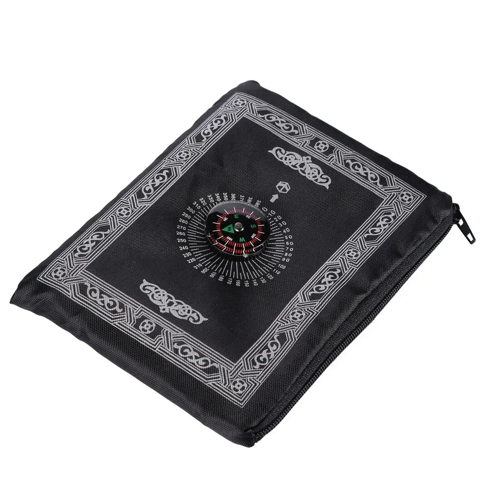 Black portable travel prayer mat with compass design featuring intricate geometric patterns.