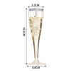 A tall, clear plastic champagne flute with a stem is shown against a white background.