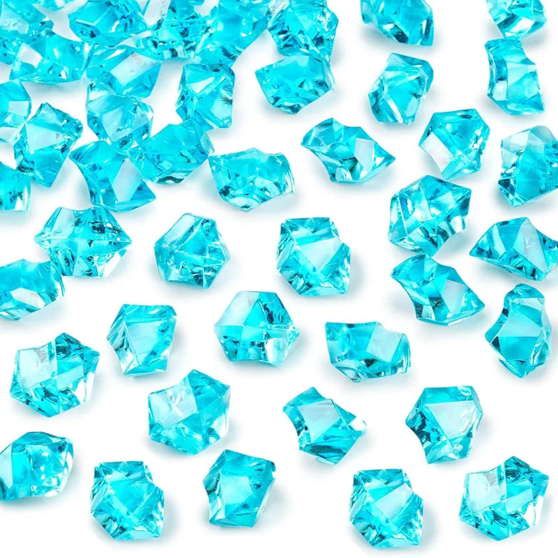 A pile of bright blue decorative crushed diamond acrylic pebbles.