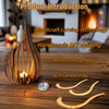 Handmade wooden lotus candle tray with curved wood pieces on a wooden surface