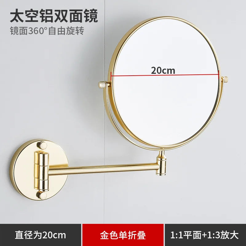 A round gold-colored folding double-sided wall mirror with a 20cm diameter and telescopic arms.