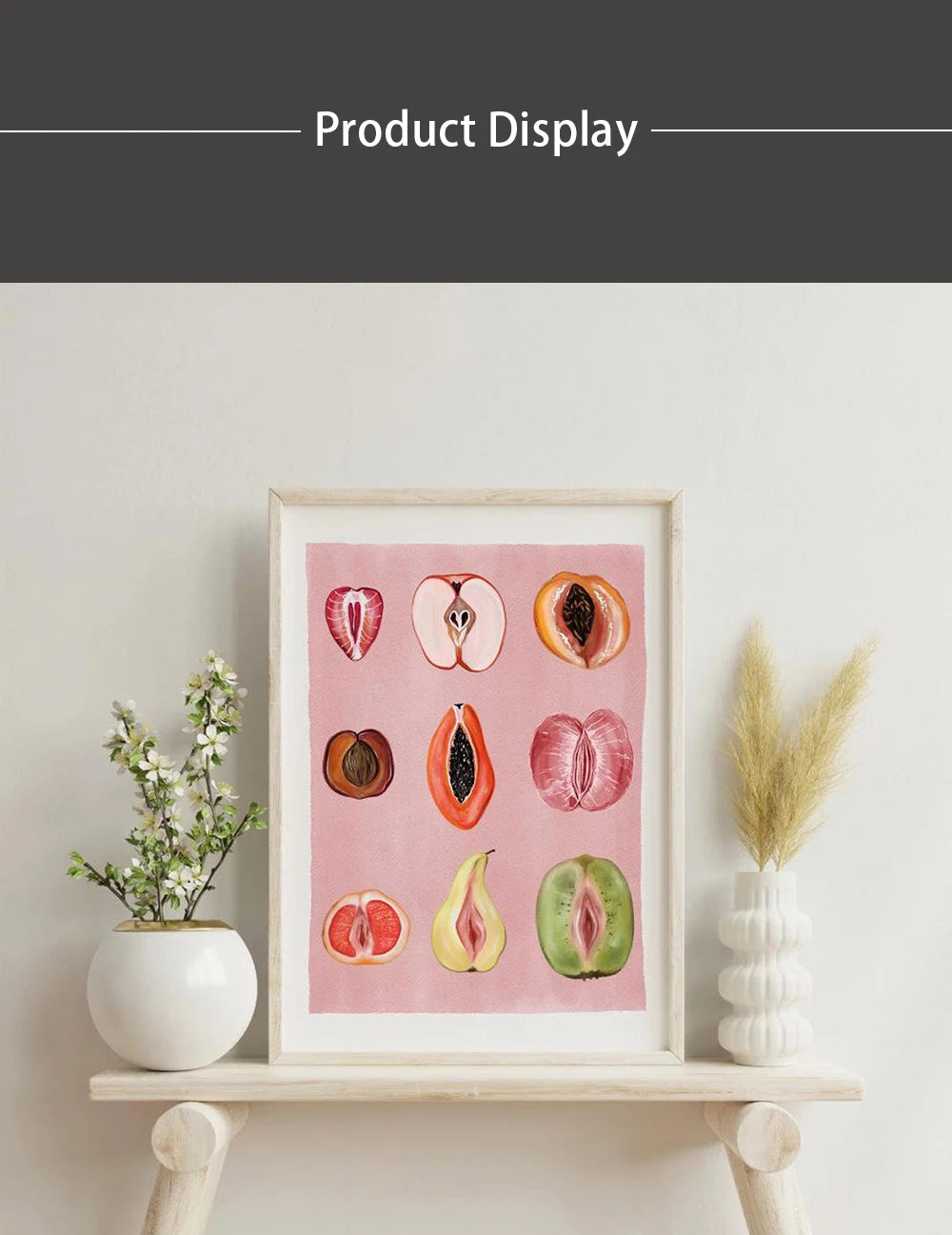 A framed canvas art display featuring watercolor paintings of various fruits like apples, pears, and citrus slices.