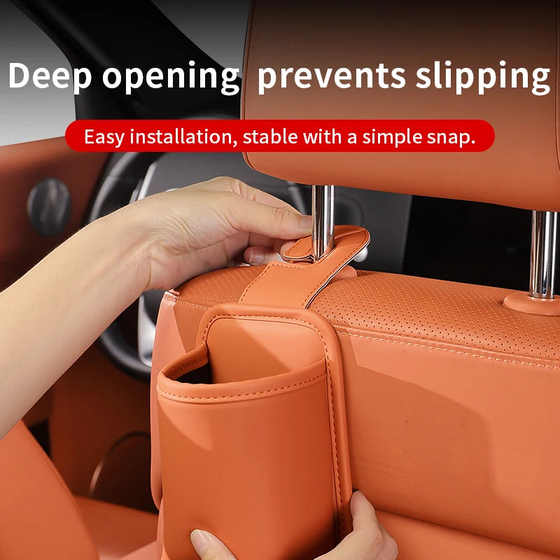 A hand installs a car seat back organizer and headrest hanger onto an orange car seat, demonstrating easy installation.