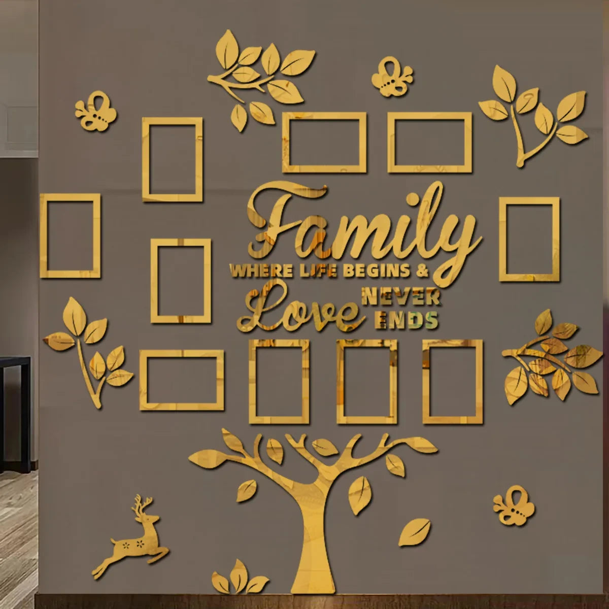 A gold-toned wooden wall decoration featuring a family tree design with leaves and empty photo frames.