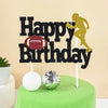 Black lettering spelling Happy Birthday with a soccer player silhouette on a green cake top