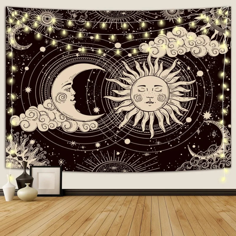 A dark tapestry wall hanging featuring a celestial design with a crescent moon, sun, and stars against a starry background.