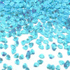 A pile of iridescent blue sea shell PVC sequins for nail art and craft decoration.