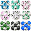 A collection of black and white soccer ball balloons used for party decorations.