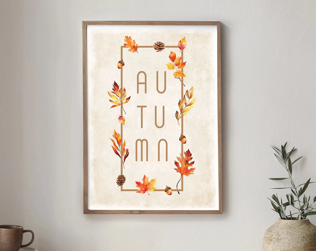 Framed canvas wall art featuring autumn leaves and acorns in warm earth tones.