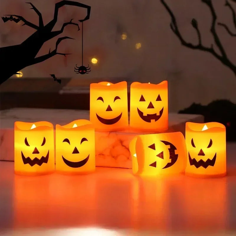 A collection of glowing orange LED candles shaped like jack-o'-lanterns and skulls for Halloween decor.