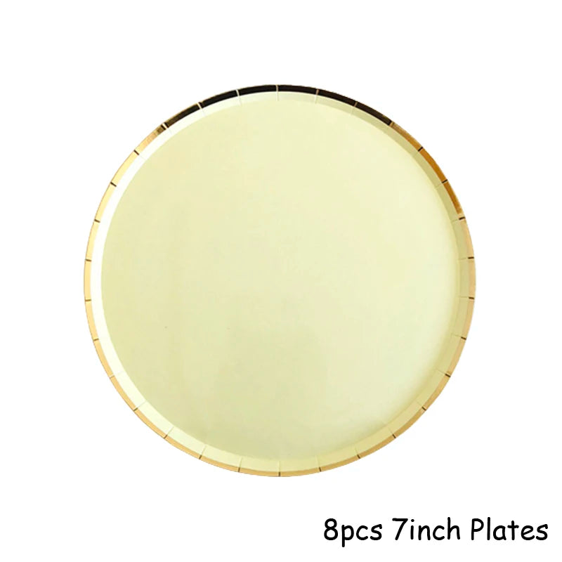 Eight 7-inch gold disposable plates shown in a circular arrangement.