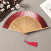 Traditional Bamboo Folding Fan with Solid Color Design