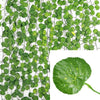 Green artificial ivy vine garland with small leaves on a black wire for hanging decor