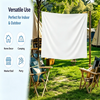 A white decorative banquet flag banner is displayed outdoors in a grassy area with tents and wooden chairs.