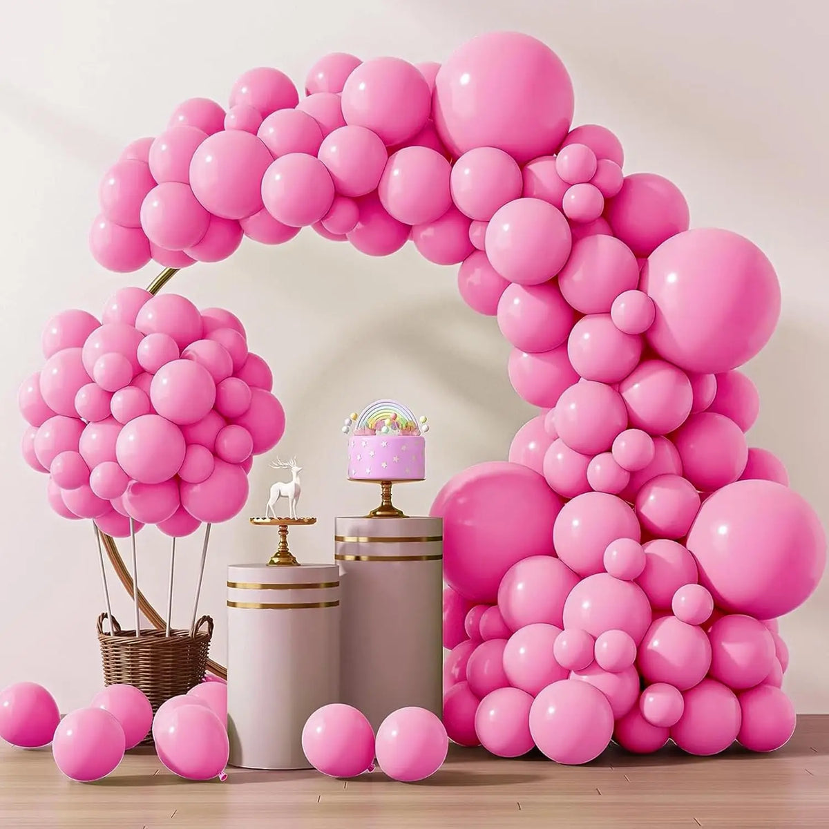 A pink balloon arch display featuring numerous round balloons arranged in an arch shape.