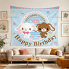 A colorful tapestry featuring a sweet illustration of a bunny and a bear with the text Happy Birthday