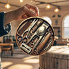 A hand holds a circular wooden sign displaying vintage barber tools like scissors and combs.