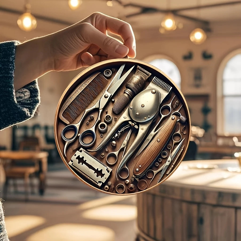 A hand holds a circular wooden sign displaying vintage barber tools like scissors and combs.