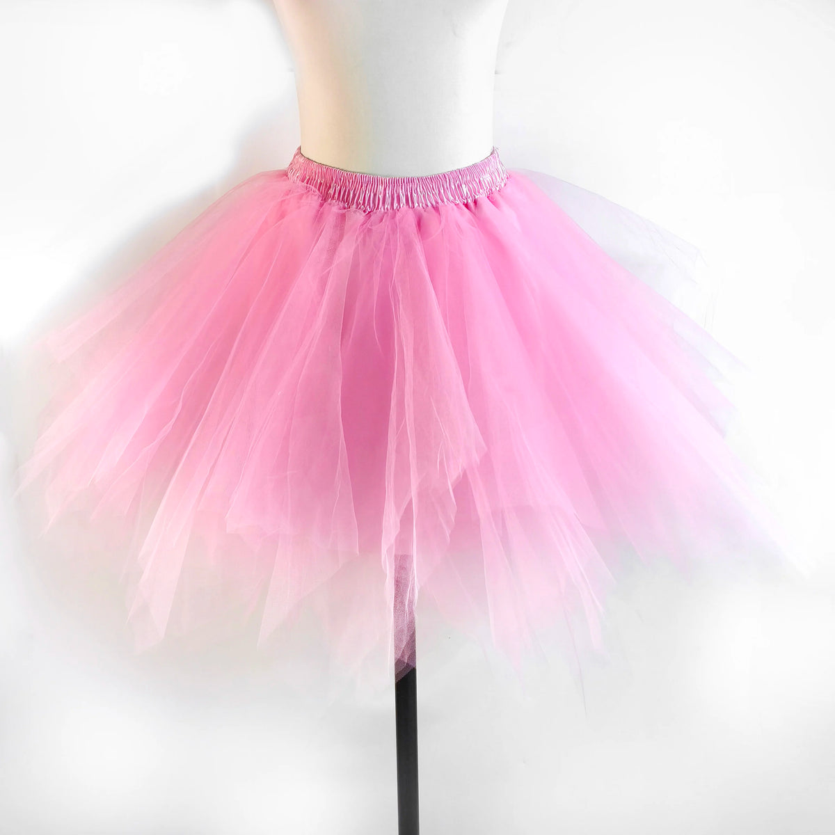 Pink tulle tutu skirt displayed on a mannequin